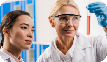Two scientists in a laboratory examining a test tube